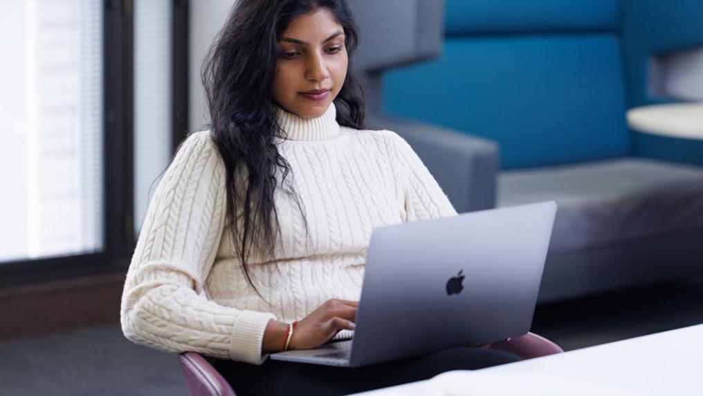 A student accesses Studiosity for academic assistance on their Macbook.