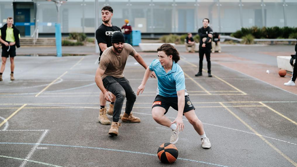 Students playing basketball at Sunshine's O-Fest.