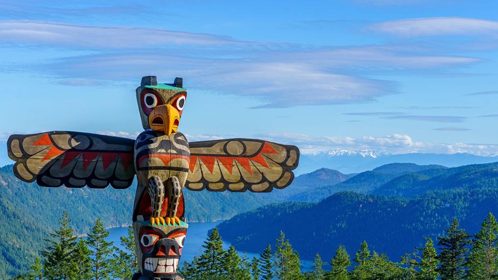 Vancouver Island with a First nations Totem pole in the foreground