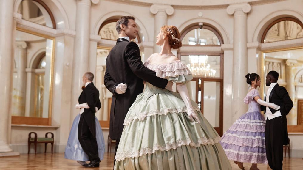 Three pairs of formally dressed people dancing in a ballroom