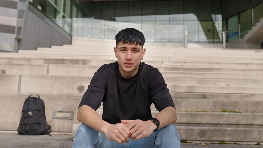 Jett sitting on stairs at VU Footscray Park campus.