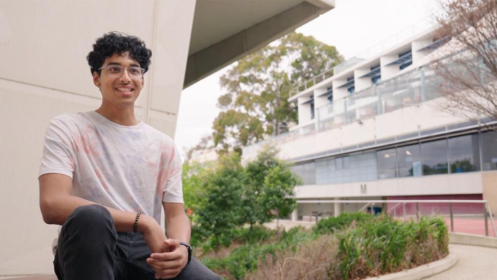 Nachiket sitting in a VU courtyard.