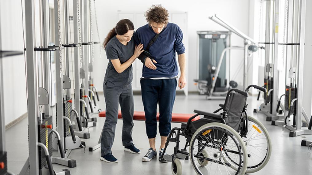 Allied health assistant with rehab patient.