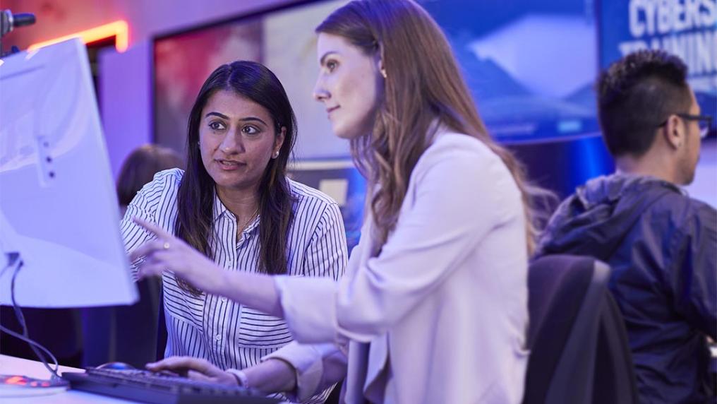 Student and teacher at VU's cyber security facility at St Alban's.