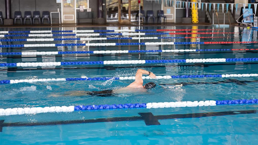 A student swims freestyle stroke in the Footscray Park Aquatic Centre.
