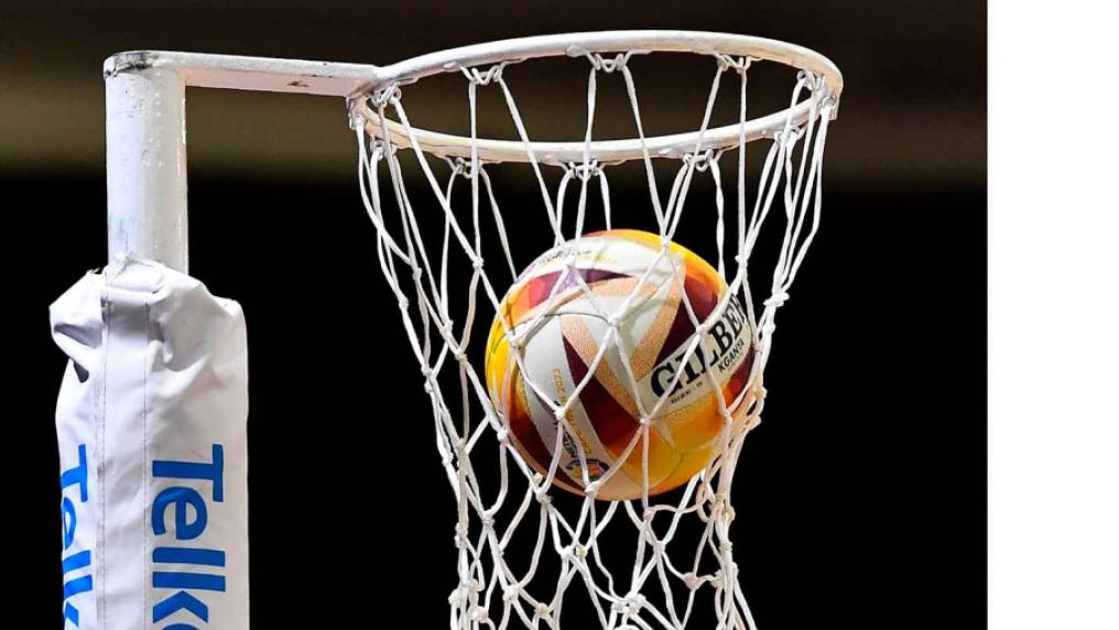 A netball going through the hoop
