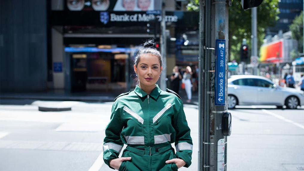 VU Paramedicine student Sarah Maclure stands in uniform on Bourke St in Melbourne.