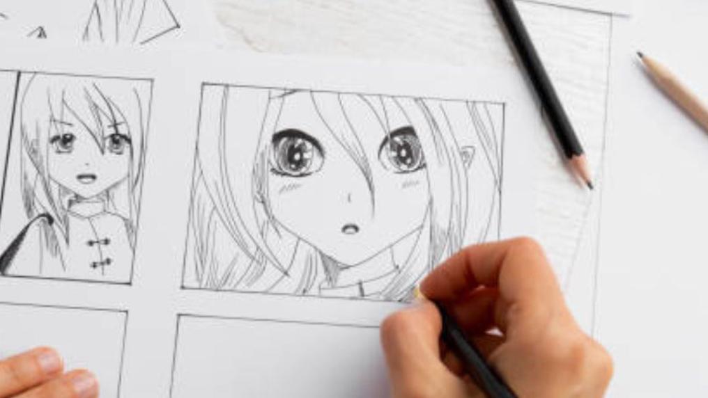 Hand drawing a manga image of a young girl in pencil.