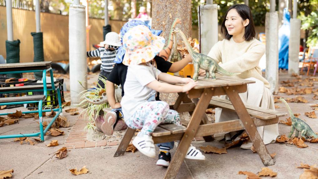 early childhood teacher playing with children