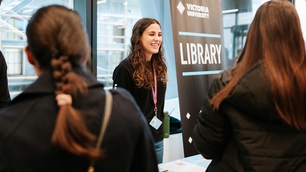 students at the library stall