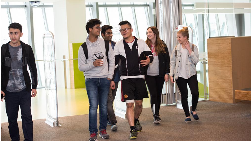 students walking into the library