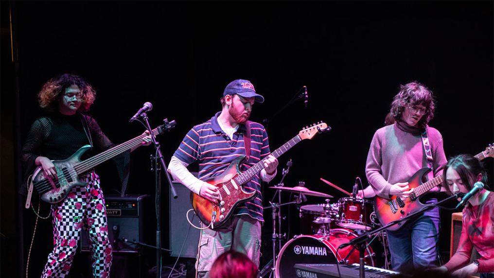 Three members of the band Swordfish playing at Kindred Studios.