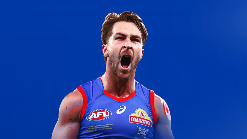 An AFL player roars in a red and blue sport uniform