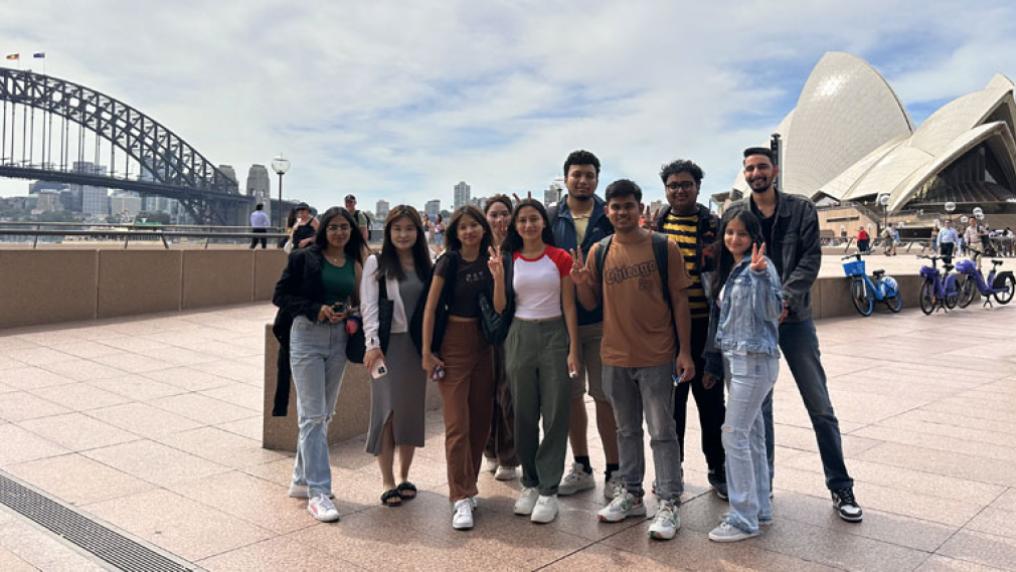 A group of VU Sydney students standing outside the Sydney Opera House