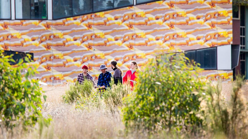 Students walk through gardens at VU's St Albans Campus.