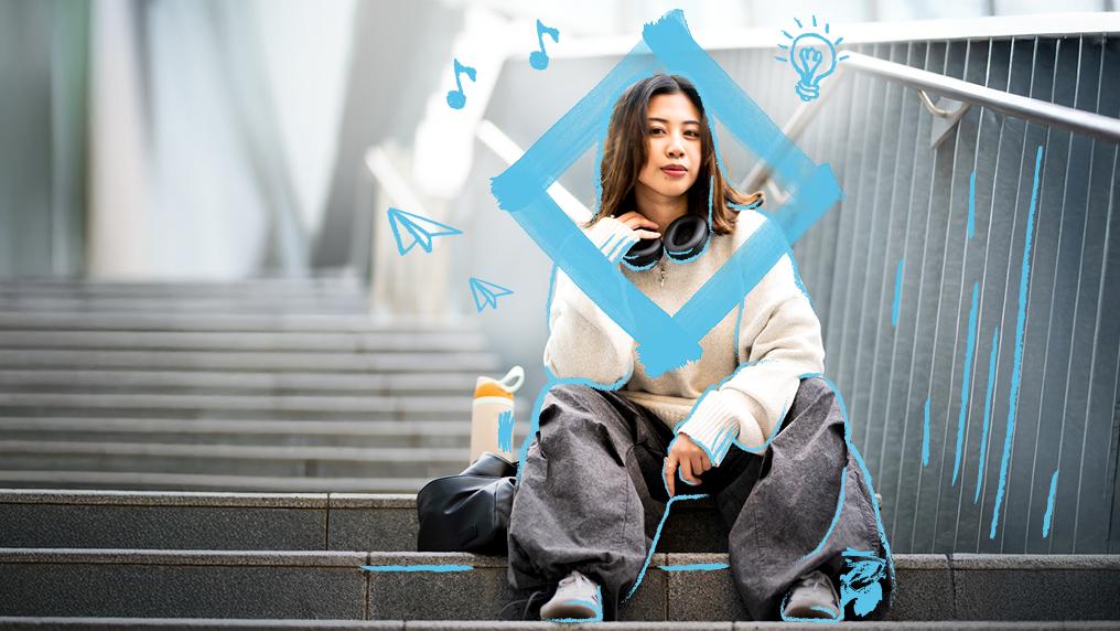 Student sitting on stairs at VU campus