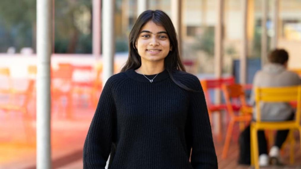 VU student standing outdoors and smiling on Footscray Park campus
