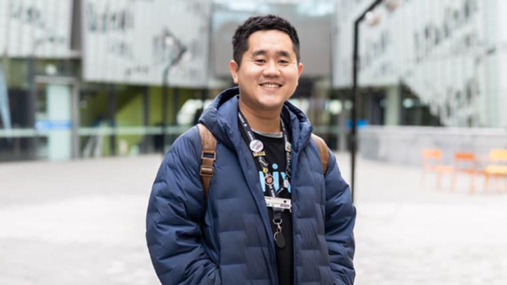 VU student standing outdoors and smiling on Footscray Park campus