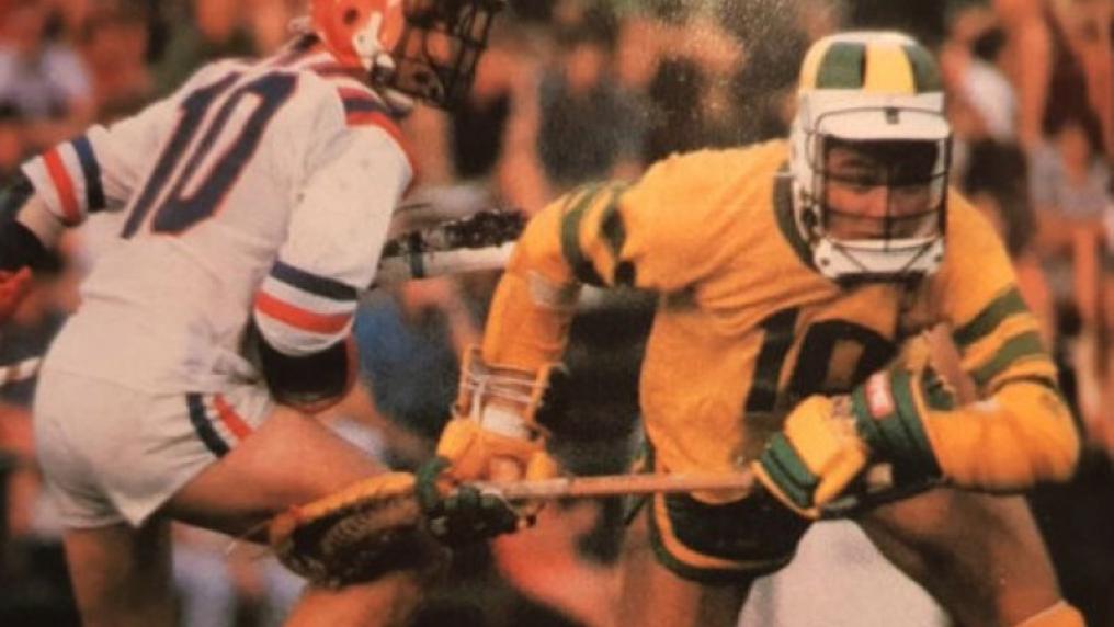 Two lacrosse players in action during match