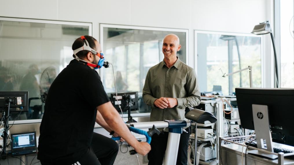 Researcher conducting VO2 max test