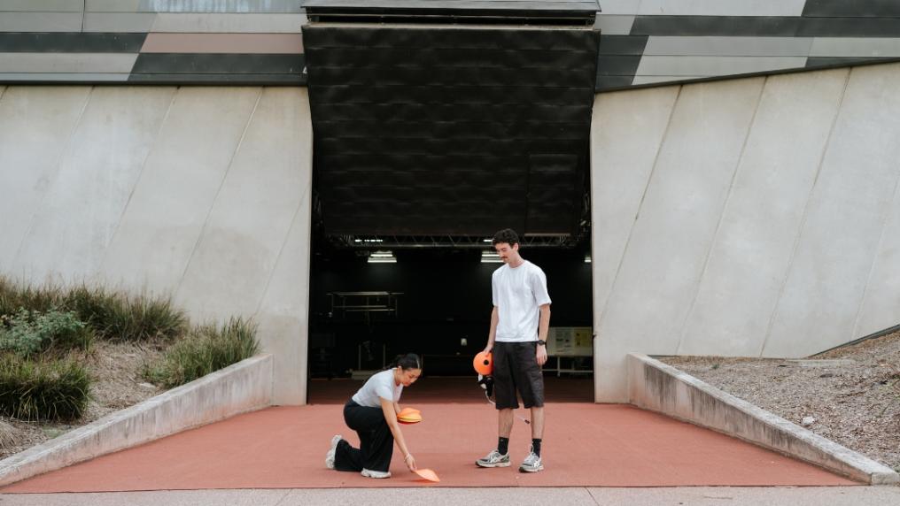Students placing cones outside biomechanics lab