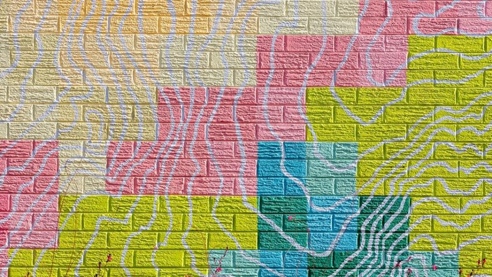 abstract patterned mural with blue, green, yellow and pink blocks of colour
