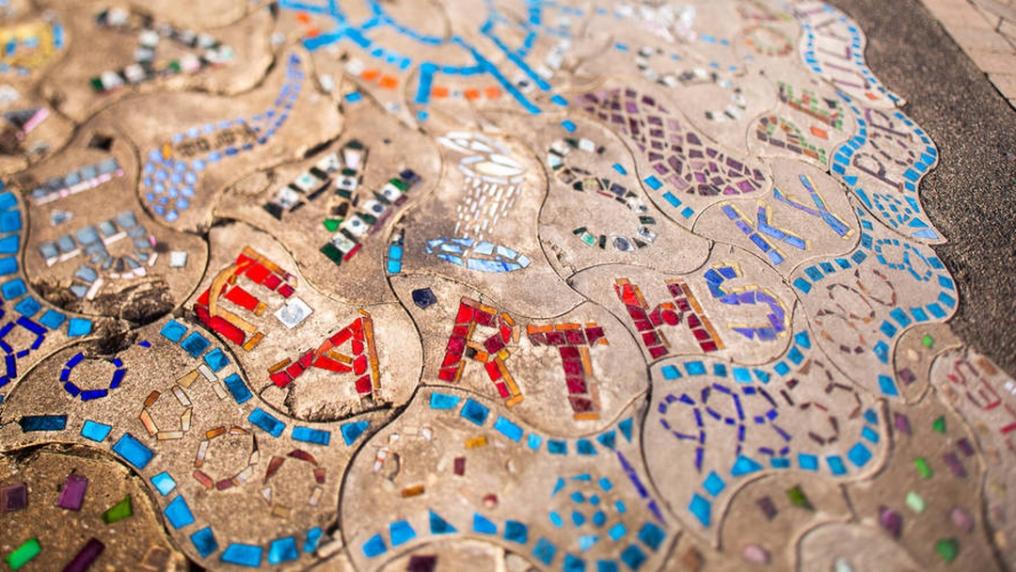 colourful mosaic tiles spelling out the words earth and sky in read andblue