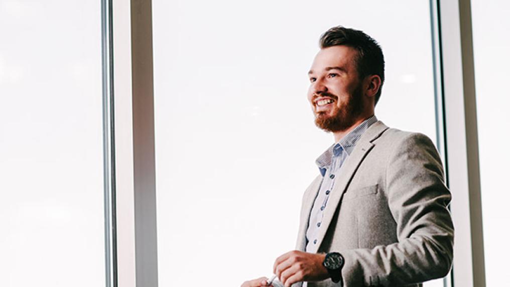   	Clifford Fahler, logistics graduate and CEVA logistics employee, at work in the NBN offices.