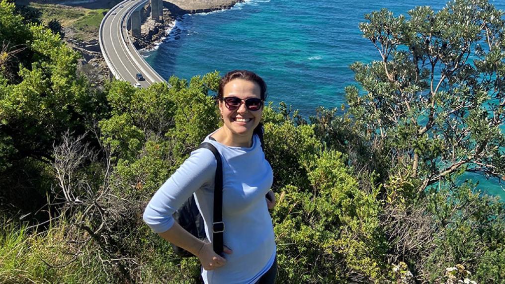 Emel Karabel in front of a view of the coast