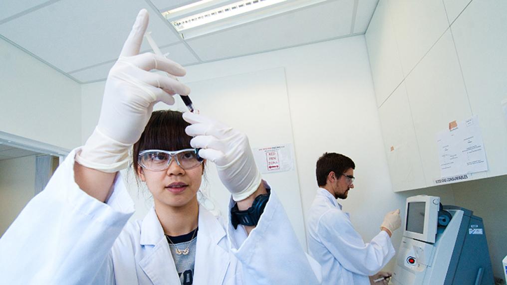  Bachelor of Science students in lab coats