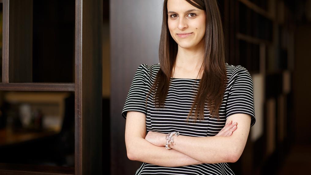Young woman in professional clothes, in office environment