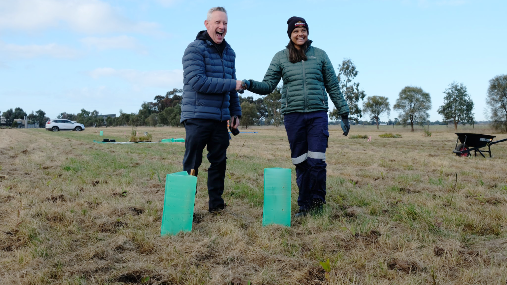  Vice Chancellor Professor Adam Shoemaker and VU Student Tahnee Towers plant the first tree.