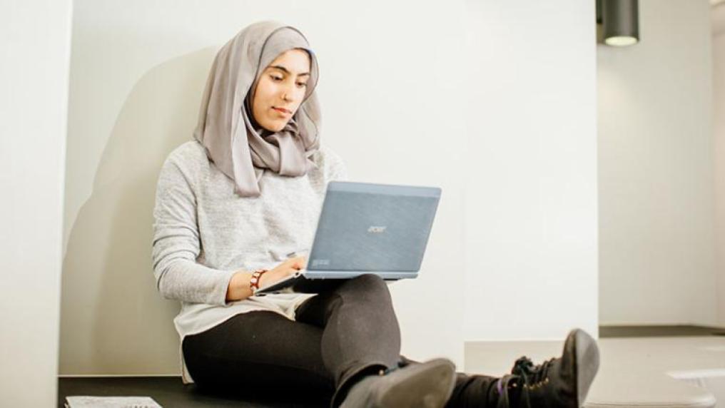 Student working and studying on a laptop