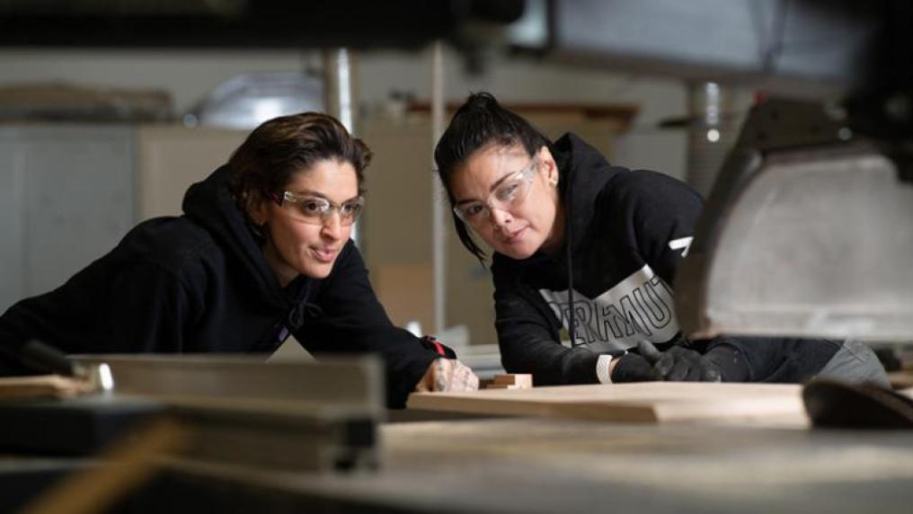 Two trades students at work.